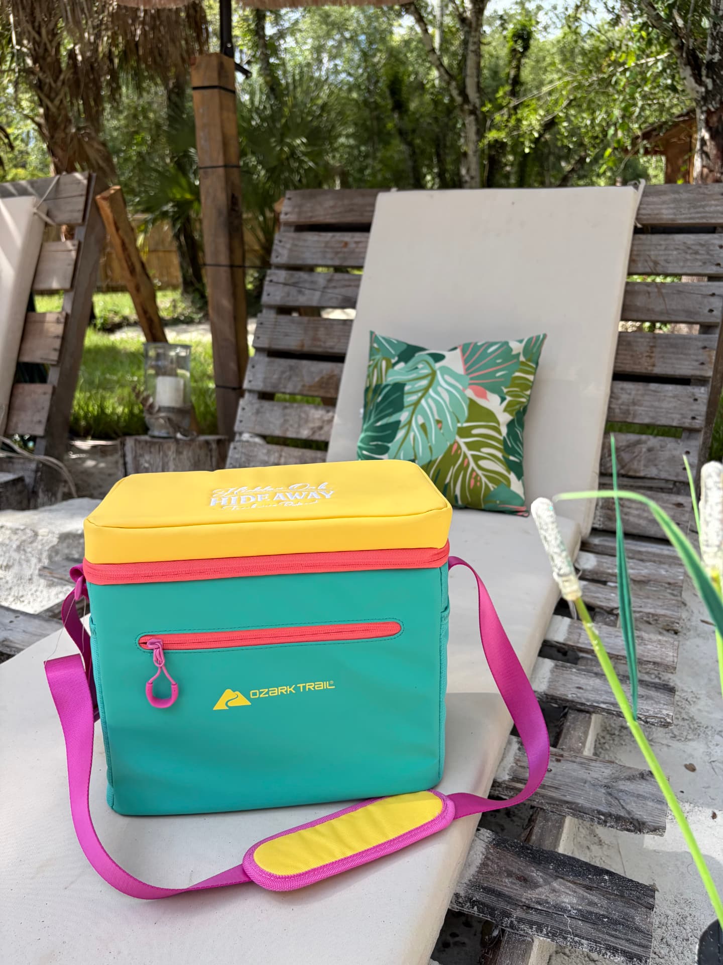 Yellow and teal Hidden Oak Hideaway cooler bag on a lounger